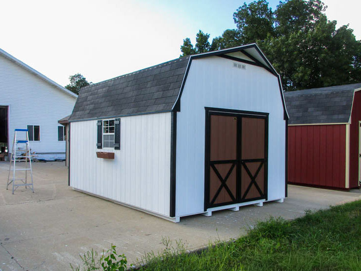 Gambrel storage barn with coordinated roof and siding