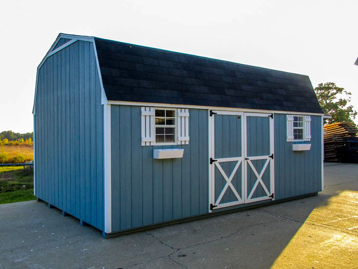 Gambrel barn with double doors and contrasting white trim