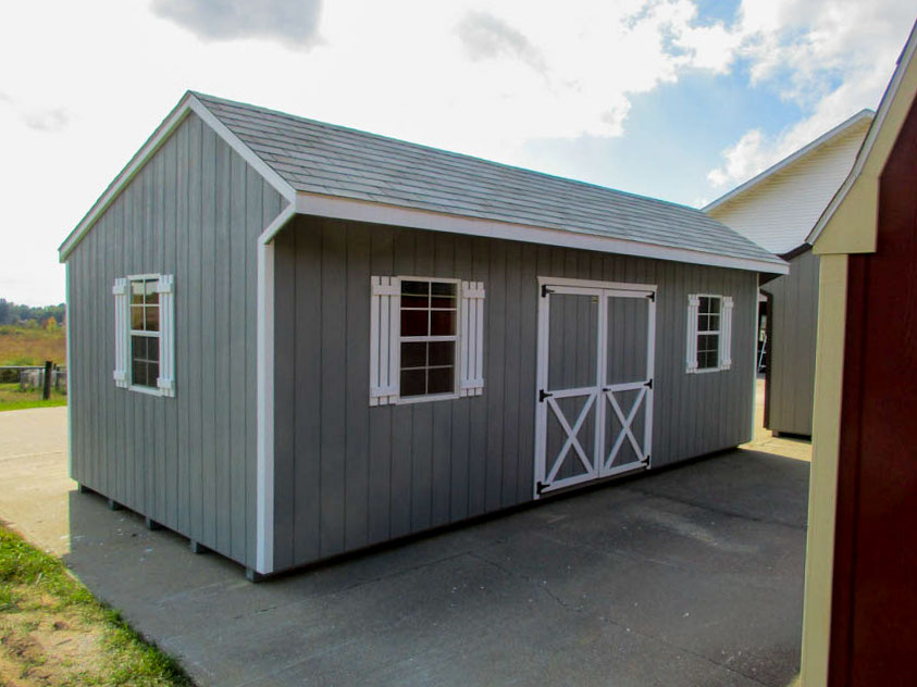 Quaker barn with offset roofline, double doors, and windows