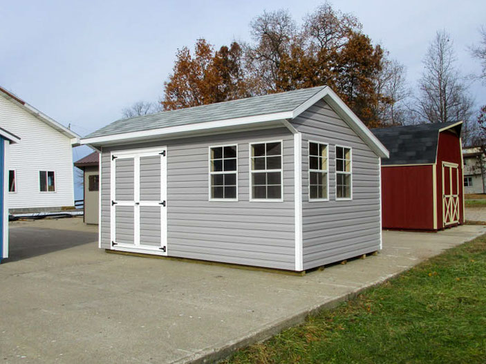 Custom Quaker barn with windows beside double doors